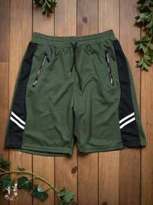 Short casual y deportivo para hombre, estampado de dos líneas pequeñas en los laterales de la prenda, talle de cintura natural con cordón y ajuste de pierna suelto, bolsillos funcionales con cierre para mayor seguridad, tela de poliéster y elastano, apto para temporadas de primavera y verano, muy fresco y cómodo, ideal para hacer deporte o el uso casual. - Verde - Ver 1