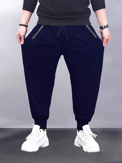 Pantalones deportivos tipo jogger con cintura con cordón y bolsillos con cremallera para hombres de talla grande
