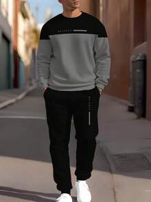 Conjunto de sudadera y pantalón de chándal casual de hombre en patchwork negro y gris, sudadera y pantalón de chándal de moda, versátil para uso al aire libre, diario, deportivo y de ocio, 100% poliéster