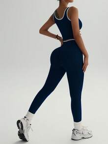 Bộ đồ tập yoga cạp cao dành cho nữ - Áo và quần legging thể thao phối màu tương phản, chất liệu vải pha polyester co giãn, phù hợp cho chạy bộ và tập luyện. - Màu xanh hải quân - Xem 6