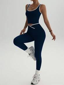 Bộ đồ tập yoga cạp cao dành cho nữ - Áo và quần legging thể thao phối màu tương phản, chất liệu vải pha polyester co giãn, phù hợp cho chạy bộ và tập luyện. - Màu xanh hải quân - Xem 4
