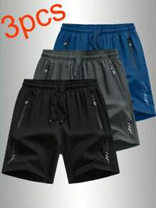 3 pares de pantalones cortos holgados y deportivos para hombre, de secado rápido, con diseño de tira reflectante, bolsillo, cremallera y cordón en la cintura, adecuados para fitness, running y actividades al aire libre.