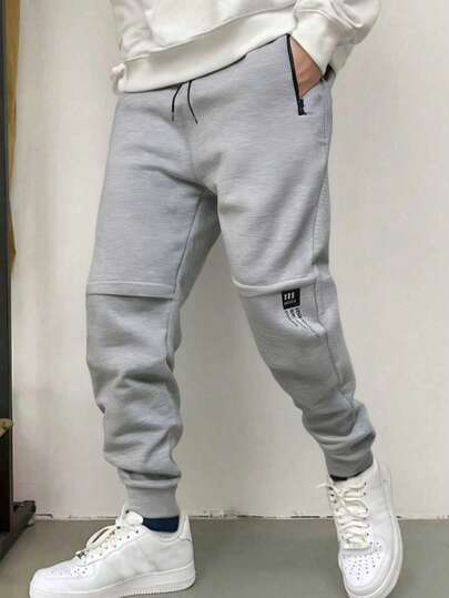 男士简约时尚风格，适合休闲和运动穿着。这款宽松抽绳腰裤采用针织面料，亲肤且弹性极佳。它是送给男友、丈夫或家人的绝佳礼物，体现了简约时尚的美学理念。男士简约抽绳腰保暖加厚裤，适合秋冬季穿着。