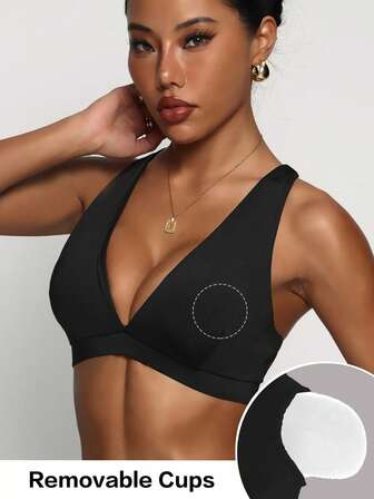 Svart, avtagbar vadderad sport-BH med djup V-ringning och korsband för kvinnor, trendig stickad