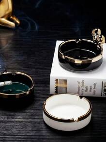 A Multi-Colored Ceramic Piece With Gilded Decoration And Luxurious Ashtray Is An Excellent Home Decor Item.