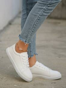 1 双女式纯色系带低帮 PU 休闲运动鞋，户外运动滑板鞋