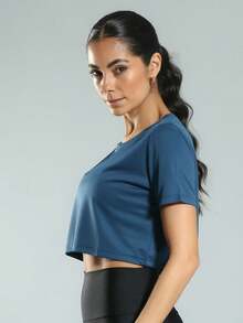 FITNATION Women's Fitness Cropped T-Shirt With DRYFIT Technology And Short Sleeves, Ideal For All Sports. - Màu xanh ngọc - Xem 2