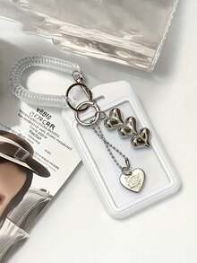 1 pezzo Portachiavi retrattile con ciondolo a forma di cuore bianco e nero, accessorio durevole e alla moda per le donne, design in plastica carino e funzionale, accessorio essenziale per il campus, portachiavi alla moda, ciondolo a forma di cuore in metallo, adatto per tessere identificative, carte di credito, abbonamenti e chiavi