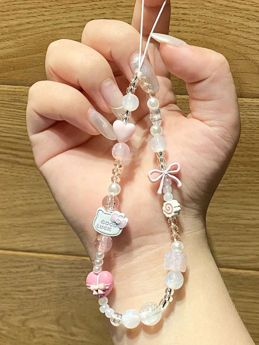 Sanrio 1 قطعة سلسلة هاتف مزينة بخرز على شكل قلب وفيونكة باللون الأبيض