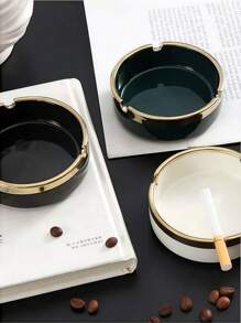 A Multi-Colored Ceramic Piece With Gilded Decoration And Luxurious Ashtray Is An Excellent Home Decor Item.