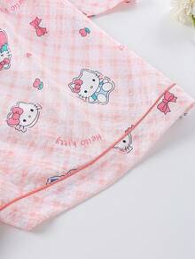 Sanrio Conjunto de 2 piezas de pijama para niñas y adolescentes con polo, cárdigan con bolsillos, estampado de Hello Kitty, flores y fresas, manga corta y pantalón corto, cómodo y casual