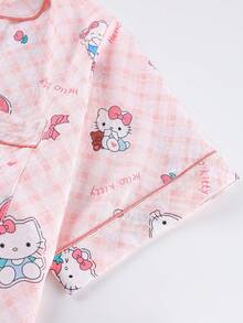 Sanrio Conjunto de 2 piezas de pijama para niñas y adolescentes con polo, cárdigan con bolsillos, estampado de Hello Kitty, flores y fresas, manga corta y pantalón corto, cómodo y casual