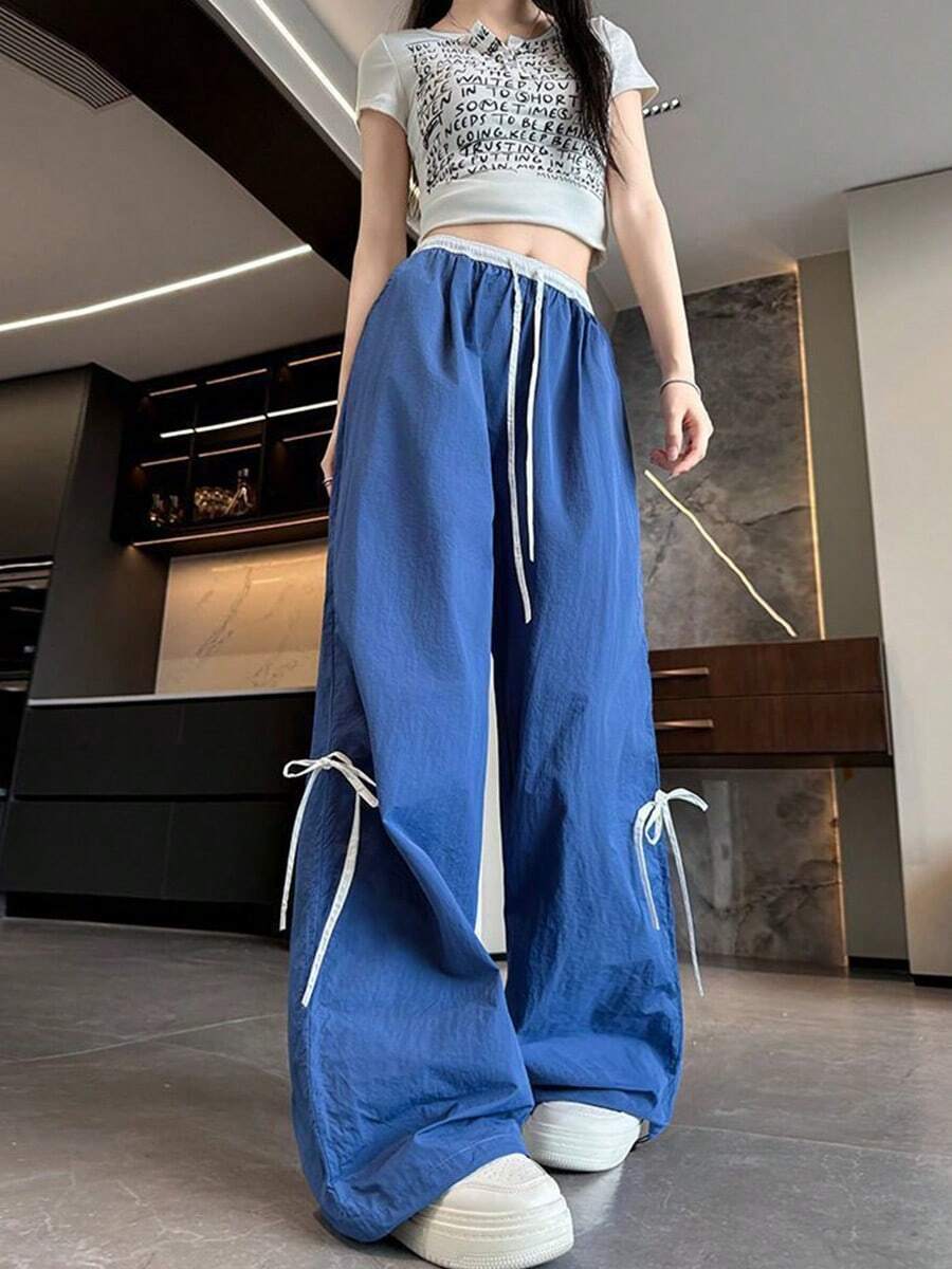 Pantalones anchos con cordón ajustable para mujer, de corte holgado e inspirados en la moda urbana, con trabillas y bolsillos, confeccionados en tejido de poliéster con detalle de lazo. - Azul oscuro - Ver 1