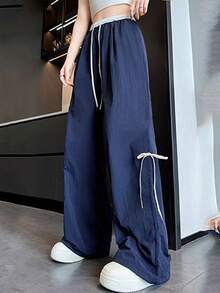 Pantalones anchos con cordón ajustable para mujer, de corte holgado e inspirados en la moda urbana, con trabillas y bolsillos, confeccionados en tejido de poliéster con detalle de lazo. - Azul Marino - Ver 2