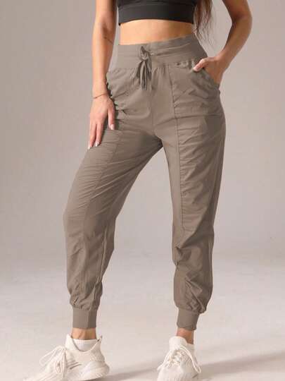 Pantalones deportivos jogger de unicolor casual con dobladillo recogido