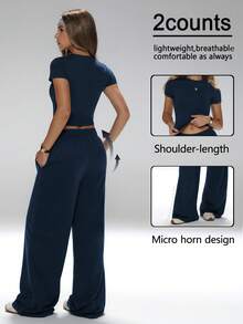 两件套，修身剪裁，配套T恤和宽松长裤，拉长腿部线条，全天舒适，简约风格，#周末穿搭 #轻松时尚，百搭运动套装，休闲居家两件套，阔腿裤套装拉长腿部线条，简约运动套装，必备圆领运动套装 - 藏蓝色 - 查看 2