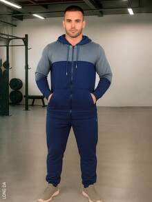 Conjunto de pants deportivo y casual para hombre, colores lisos con franja grande en la parte frontal, sin estampados, tela de poliéster, algodón y spandex, apto para temporadas de primavera y verano. pants de ajuste regular con bota semi-entubada, talle de cintura natural, bolsillos laterales funcionales con cremallera. Sudadera deportiva, cuello redondo con capucha, silueta de ajuste regular, cierre con cremallera y bolsillos frontales funcionales. Muy fresco y cómodo, ideal para hacer deporte al aire libre, caminata en el parque o para ir al gimnasio. - Azul - Ver 1