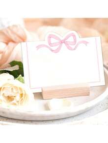 50 piezas Tarjetas de mesa con lazo rosa, tarjetas de nombre de estilo carpa con lazo lindo, tarjetas de asignación de asientos en blanco, suministros de decoración de mesa de fiesta de cumpleaños para decoración de mesa de fiesta de cumpleaños, regalos, decoraciones de graduación, cumpleaños, decoraciones de fiesta, decoraciones de boda, verano, playa, regreso a la escuela, útiles escolares, decoración de habitación
