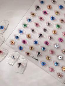 1张闪亮恶魔天使之眼美甲贴纸 - 3D果冻金箔卡通怪兽贴纸，适用于DIY美甲、手机壳等 - 自粘式，亮面，多种颜色（蓝、绿、粉、黄、橙），美甲贴纸，创意手工，奇趣设计，单张 - 彩色 - 查看 7