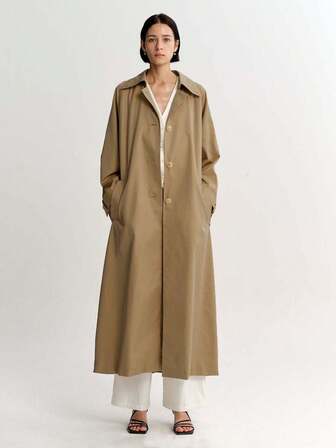 Långärmad, enkelknäppt, lång, avslappnad trenchcoat med nedfällbar krage