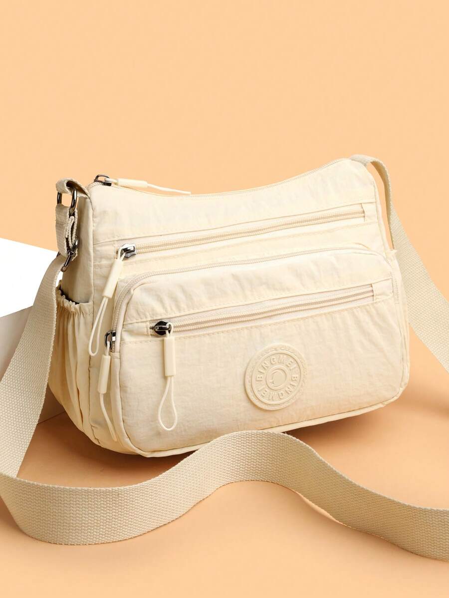 Sac à bandoulière en nylon décontracté avec sangle réglable, compartiments multiples, couleur unie, fermeture à glissière, doublure en polyester, sac bandoulière léger et pratique pour un usage quotidien