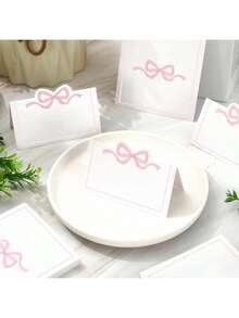 50 piezas Tarjetas de mesa con lazo rosa, tarjetas de nombre de estilo carpa con lazo lindo, tarjetas de asignación de asientos en blanco, suministros de decoración de mesa de fiesta de cumpleaños para decoración de mesa de fiesta de cumpleaños, regalos, decoraciones de graduación, cumpleaños, decoraciones de fiesta, decoraciones de boda, verano, playa, regreso a la escuela, útiles escolares, decoración de habitación