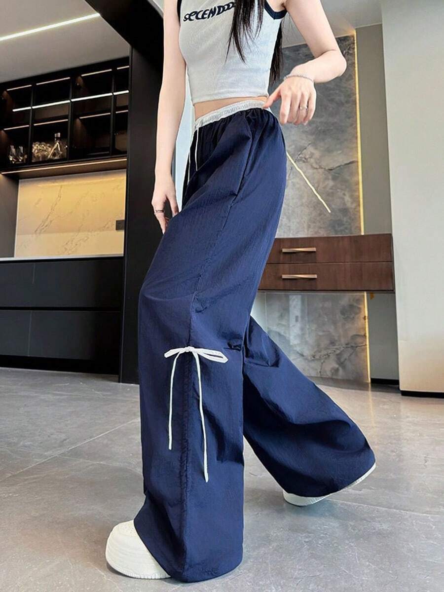 Pantalones anchos con cordón ajustable para mujer, de corte holgado e inspirados en la moda urbana, con trabillas y bolsillos, confeccionados en tejido de poliéster con detalle de lazo. - Azul Marino - Ver 1