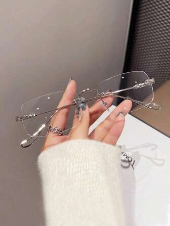 一副无框轻便时尚女士眼镜，透明镜片营造时尚复古外观。女士透明眼镜配件，眼镜配件