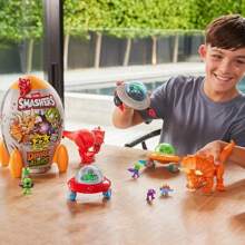Spin Master Pudełko z niespodzianką Smashers Dino kontra Obcy, kolekcjonerskie zabawki i gadżety, ponad 25 niespodzianek, prezent w postaci jajka-niespodzianki, zabawa dla chłopców i dzieci