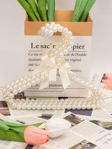 1/3/5/10件仿珍珠衣架，带蝴蝶结，仿珍珠裤夹，适合儿童使用的小型衣架和宠物衣架。这款挂衣架适合悬挂仙女风格的服装，例如连衣裙、裤子、鞋子、牛仔裤、靴子和裙子。它适合春季的极简主义风格，也可用于悬挂夏季上衣。