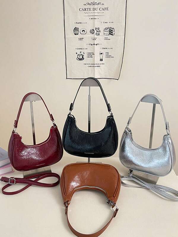 Bolso de hombro de media luna de gran capacidad y estilo casual para mujer, con estampado de letras en relieve con efecto dorado, estilo vintage de moda 2025, bolso tote retro simple para uso diario y transporte.
