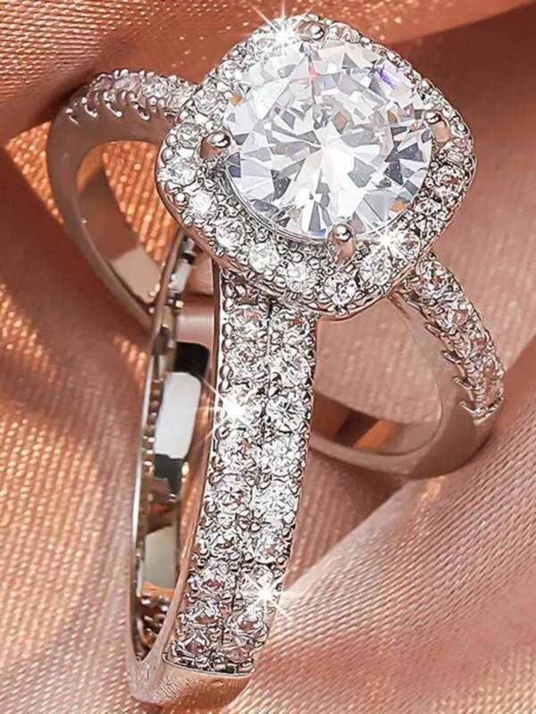 1 par de anillos de pareja de circonita cúbica de moda, diseño unisex con centro de circonita sintética redonda y ajuste de halo cuadrado, piedras de acento brillantes en la banda, adecuado como anillo de compromiso o accesorio diario para expresar amor