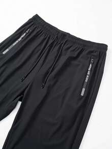 男士高弹力健身休闲日常针织面料长裤，黑色，纯色设计，柔软透气面料，宽松版型，户外休闲服饰，活力生活方式，带拉链口袋的运动裤 - 适合跑步、健身、篮球训练，春、夏、秋季休闲穿着，纯色设计 | 面料质感顺滑 - 黑色 - 查看 3