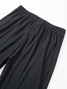 男士高弹力健身休闲日常针织面料长裤，黑色，纯色设计，柔软透气面料，宽松版型，户外休闲服饰，活力生活方式，带拉链口袋的运动裤 - 适合跑步、健身、篮球训练，春、夏、秋季休闲穿着，纯色设计 | 面料质感顺滑 - 黑色 - 查看 4