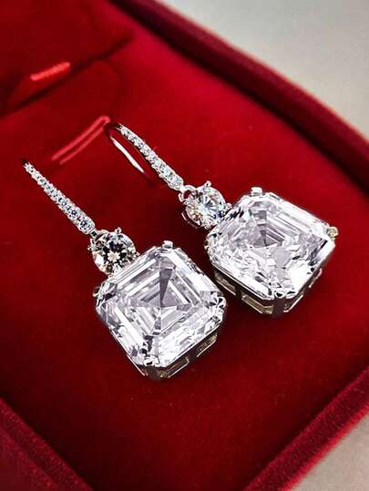 一对优雅的黄色立方氧化锆水滴耳环，适合作为情人节礼物送给女性。