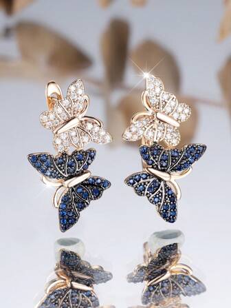 1 par de pendientes elegantes con diseño de mariposa con circonita sintética azul y blanca, chapado en oro champán, de lujo para bodas, fiestas y uso diario, adecuado para todas las estaciones