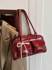 1个FEISTURE纯色PU保龄球包，斜挎/腋下手提包，女士款（带仿珍珠吊坠），适合购物、约会、作为女士礼物，适合青少年、大学生、初学者和上班族，是办公室、大学、工作、通勤的理想之选，也是情人节礼物的最佳选择，时尚蝴蝶结女士包 - 酒紅色 - 查看 3