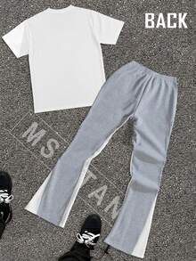 The "FIRST SUNDAY" Men's Fashion Suit Consists Of A Round-Neck T-Shirt Paired With Drawstring Sweatpants. The Overall Style Is Fashionable And Individual, Suitable For Everyday Wear. - Quần xám - áo trắng - Xem 2