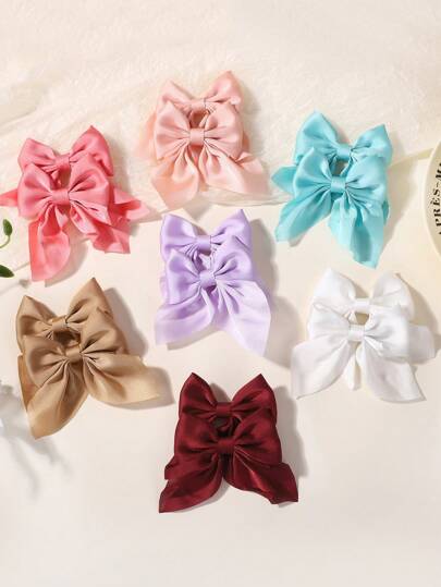 2 urocze spinki do włosów z kokardką – modny design, pasujące do różnych fryzur i okazji. Minimalistyczny styl, idealny dla dziewczynek, idealny dodatek do szkoły, na imprezę lub na co dzień.