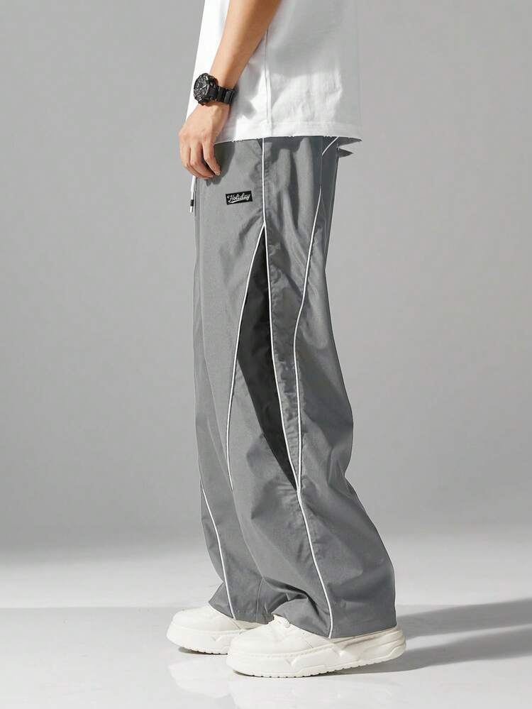 男士街头风慢跑裤 - 轻盈涤纶运动裤，侧边条纹，带口袋和抽绳腰带，撞色休闲运动裤，适合街头穿搭、慢跑、户外休闲、健身房等场合，时尚百搭。 - 灰色 - 查看 4
