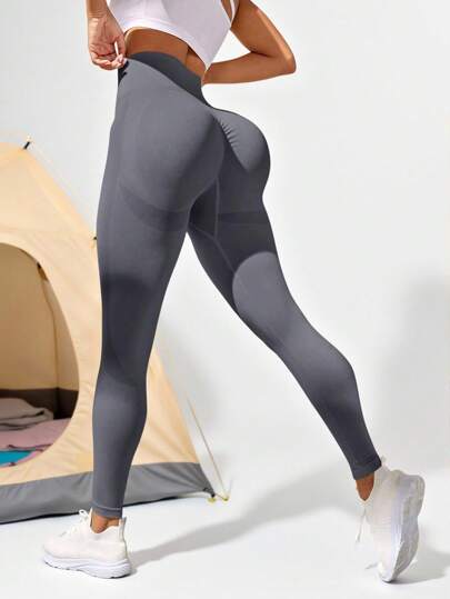 Enfärgade sportleggings med brett midjeband och utomhusbruk