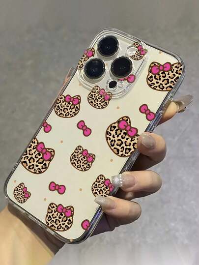 Sanrio 1 pezzo Custodia protettiva per telefono con stampa leopardata e fiocco rosa di Hello Kitty, adatta come regalo per fidanzata, sorella, amica, zia, mamma, coppie, compleanni, compatibile con 17/16/15/14/13/12/11/Pro/ProMax/X/XR/XS/XSMAX/7/8/PLUS e modelli