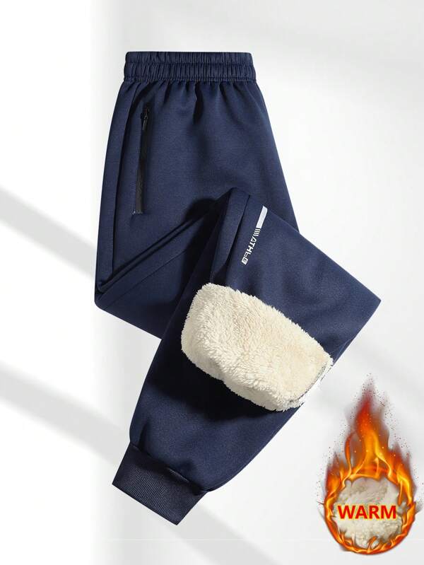 1 Piece Of Men's Casual Fleece Leg Tied Pants With Zippered Pockets, Featuring Thick Lamb Wool Lining For Warmth And A Comfortable And Cozy Wearing Experience.