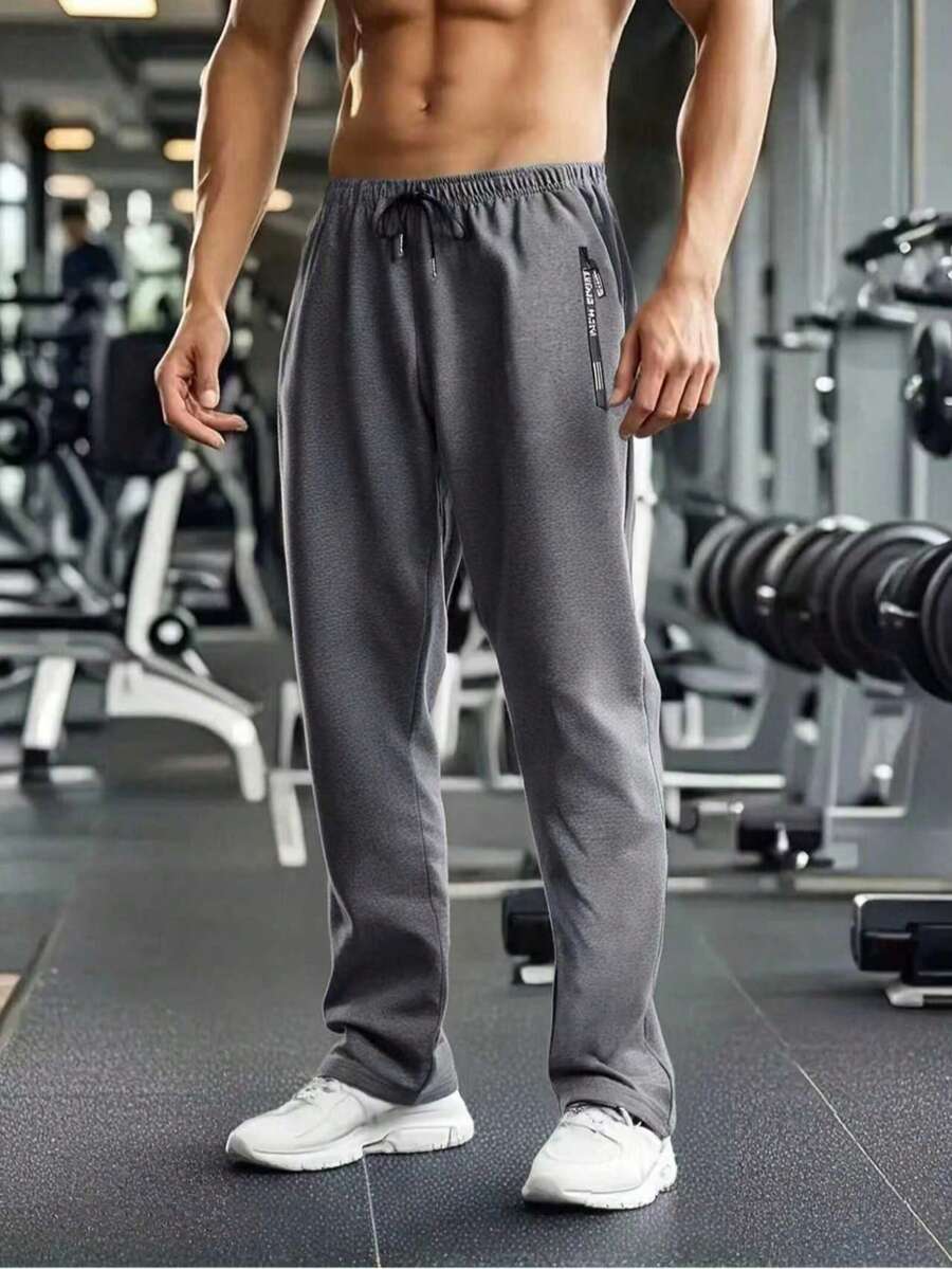 1 chiếc quần thể thao nam màu trơn, cạp chun, kiểu dáng thường ngày, chất liệu cơ bản, thích hợp cho tập luyện.