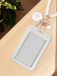 这款黑/白/粉色卡包配有心形吊坠和仿珍珠链，可用作包包装饰、钥匙扣，也可用于收纳身份证、会员卡、照片、地址卡，同时还能起到保护作用。这款卡包既可日常使用，也可作为装饰品，或作为礼物赠送给朋友、家人和爱人，适合作为情人节、生日、母亲节、开学季礼物。 - 彩色 - 查看 6