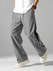 男士街头风慢跑裤 - 轻盈涤纶运动裤，侧边条纹，带口袋和抽绳腰带，撞色休闲运动裤，适合街头穿搭、慢跑、户外休闲、健身房等场合，时尚百搭。 - 灰色 - 查看 6