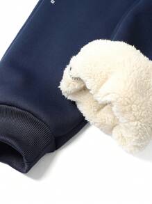 1 pieza de pantalones casuales de hombre con cordones en las piernas y bolsillos con cremallera, con forro de lana de cordero grueso para mantener el calor y una experiencia de uso cómoda y acogedora.