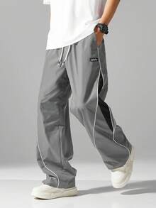 男士街头风慢跑裤 - 轻盈涤纶运动裤，侧边条纹，带口袋和抽绳腰带，撞色休闲运动裤，适合街头穿搭、慢跑、户外休闲、健身房等场合，时尚百搭。 - 灰色 - 查看 9