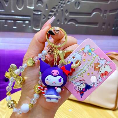 三丽鸥天使吊饰 - 官方授权配饰，饰有梦幻天使图案。可调节链条，细节精致，完美搭配包袋或钥匙，提升您的日常造型。