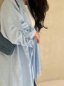 这款优雅经典的极简主义抽绳袖口女式睡袍散发着高贵典雅的气息，适合所有季节和各种文化活动。 - 淺藍色 - 查看 3